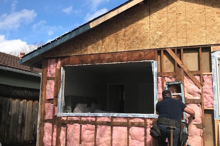 Exterior wall framing and insulation during window installation